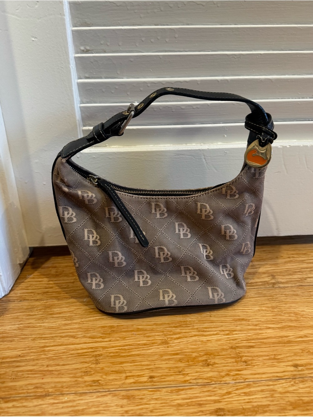 Vintage Dooney and Bourke brown tan monogram small bucket hobo bag